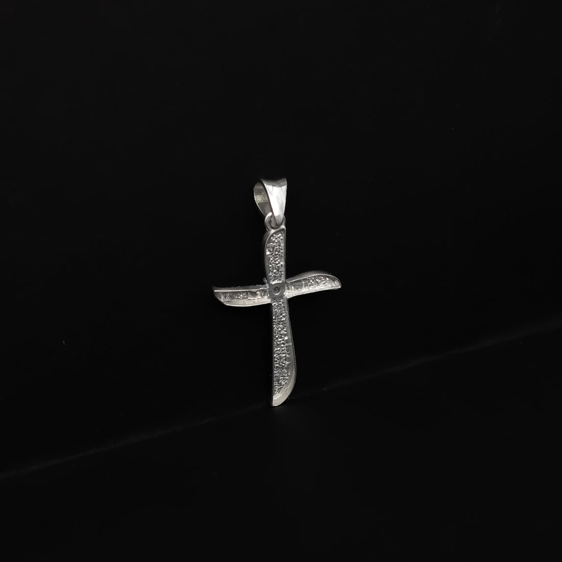 The Stardust Curve Cross Charm