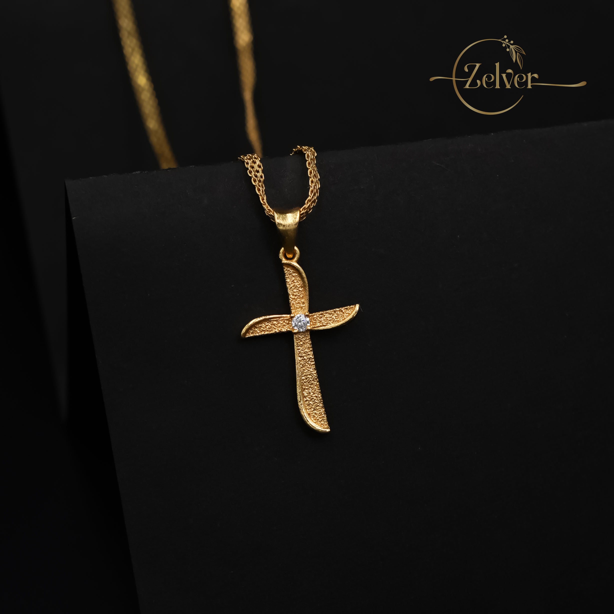 The Stardust Curve Cross Charm