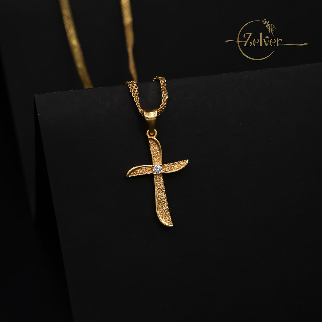 The Stardust Curve Cross Charm