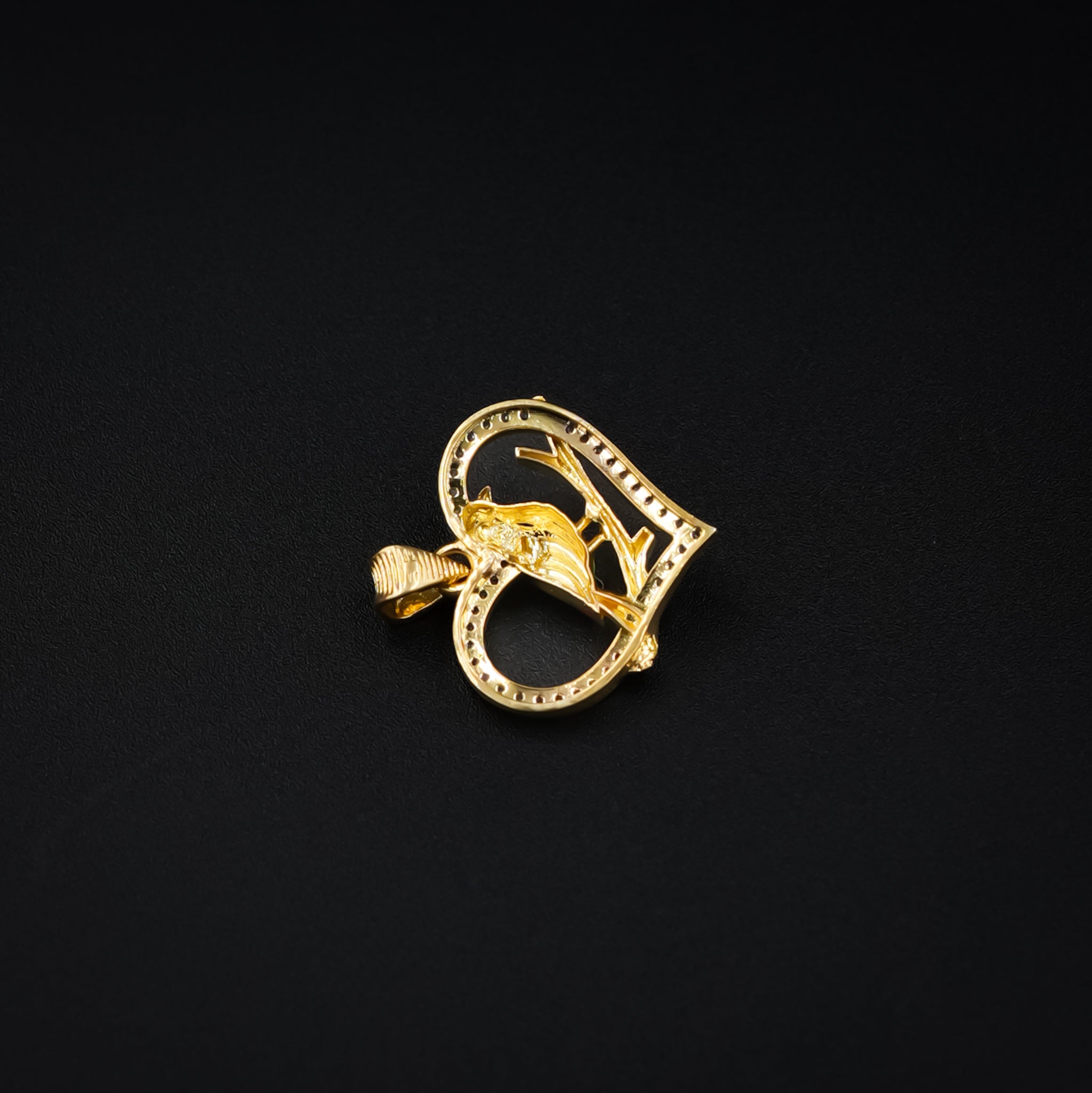 Heart-shaped bird pendant