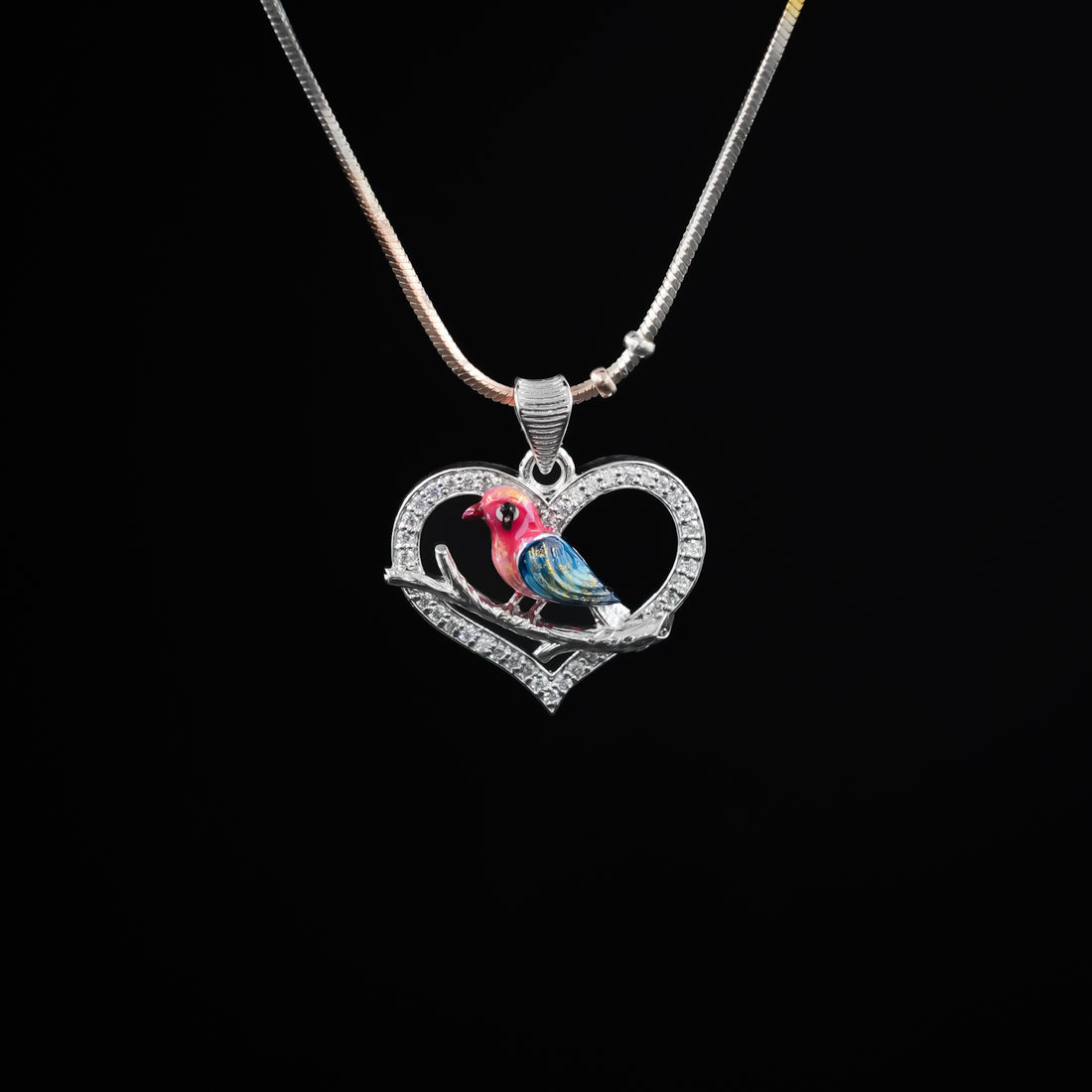 Heart-shaped bird pendant
